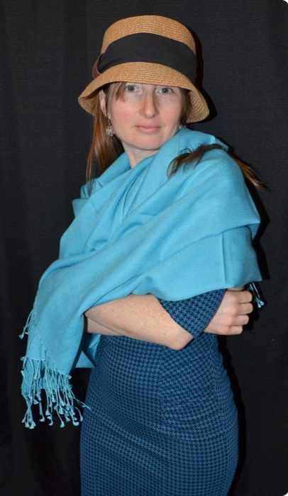Empar is wearing a light turquoise 70% pashmina 30% silk Ama Dablam shawl